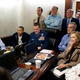 President Obama and Vice President Biden, along with members of the national security team, receive an update on the mission against bin Laden in the Situation Room of the White House